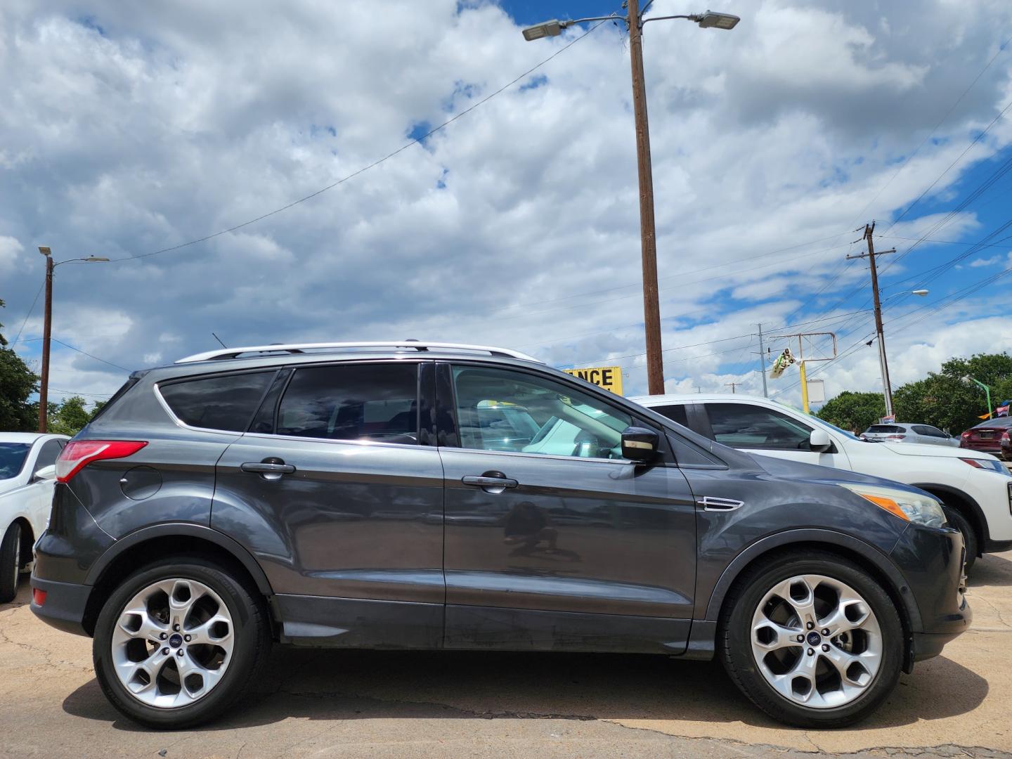 2016 GRAY /BLACK Ford Escape Titanium (1FMCU0J97GU) with an 2.0L L4 DOHC 16V engine, 6-Speed Automatic transmission, located at 2660 S.Garland Avenue	, Garland, TX, 75041, (469) 298-3118, 32.885387, -96.656776 - CASH$$$$$$$$ ESCAPE TITANIUM!! This is a Super Clean 2016 FORD ESCAPE TITANIUM SUV! PUSH START! NAVIGATION! BACK UP CAMERA! PANO ROOF! HEATED/LEATHER SEATS! BLUETOOTH! SAT RADIO! SUPER CLEAN! MUST SEE! Come in for a test drive today. We are open from 10am-7pm Monday-Saturday. Call us with any - Photo#2