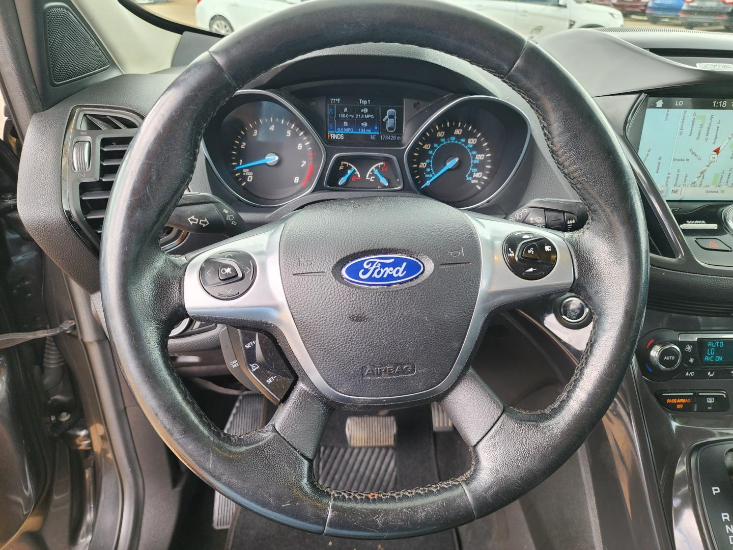 2016 GRAY /BLACK Ford Escape Titanium (1FMCU0J97GU) with an 2.0L L4 DOHC 16V engine, 6-Speed Automatic transmission, located at 2660 S.Garland Avenue	, Garland, TX, 75041, (469) 298-3118, 32.885387, -96.656776 - CASH$$$$$$$$ ESCAPE TITANIUM!! This is a Super Clean 2016 FORD ESCAPE TITANIUM SUV! PUSH START! NAVIGATION! BACK UP CAMERA! PANO ROOF! HEATED/LEATHER SEATS! BLUETOOTH! SAT RADIO! SUPER CLEAN! MUST SEE! Come in for a test drive today. We are open from 10am-7pm Monday-Saturday. Call us with any - Photo#12