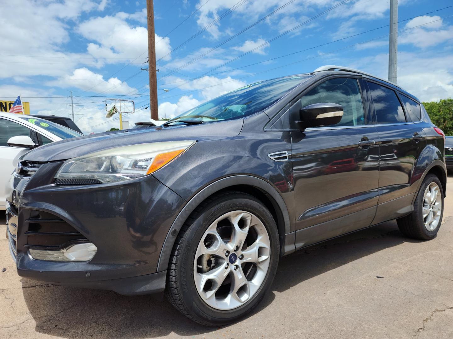 2016 GRAY /BLACK Ford Escape Titanium (1FMCU0J97GU) with an 2.0L L4 DOHC 16V engine, 6-Speed Automatic transmission, located at 2660 S.Garland Avenue	, Garland, TX, 75041, (469) 298-3118, 32.885387, -96.656776 - CASH$$$$$$$$ ESCAPE TITANIUM!! This is a Super Clean 2016 FORD ESCAPE TITANIUM SUV! PUSH START! NAVIGATION! BACK UP CAMERA! PANO ROOF! HEATED/LEATHER SEATS! BLUETOOTH! SAT RADIO! SUPER CLEAN! MUST SEE! Come in for a test drive today. We are open from 10am-7pm Monday-Saturday. Call us with any - Photo#7