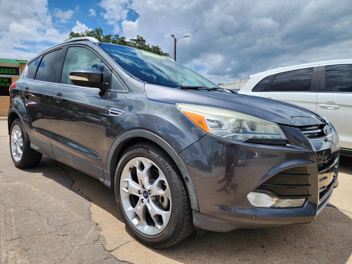 2016 GRAY /BLACK Ford Escape Titanium (1FMCU0J97GU) with an 2.0L L4 DOHC 16V engine, 6-Speed Automatic transmission, located at 2660 S.Garland Avenue	, Garland, TX, 75041, (469) 298-3118, 32.885387, -96.656776 - CASH$$$$$$$$ ESCAPE TITANIUM!! This is a Super Clean 2016 FORD ESCAPE TITANIUM SUV! PUSH START! NAVIGATION! BACK UP CAMERA! PANO ROOF! HEATED/LEATHER SEATS! BLUETOOTH! SAT RADIO! SUPER CLEAN! MUST SEE! Come in for a test drive today. We are open from 10am-7pm Monday-Saturday. Call us with any - Photo#1