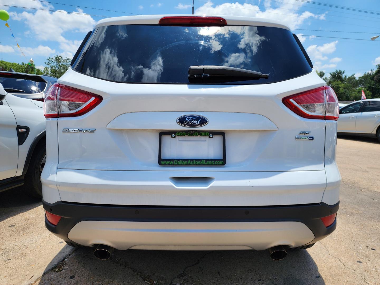 2016 WHITE Ford Escape SE (1FMCU9GX0GU) with an 1.6L L4 DOHC 16V engine, 6-Speed Automatic transmission, located at 2660 S.Garland Avenue, Garland, TX, 75041, (469) 298-3118, 32.885387, -96.656776 - Photo#4