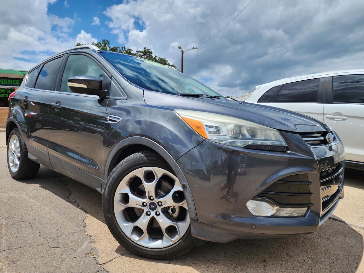 2016 GRAY /BLACK Ford Escape Titanium (1FMCU0J97GU) with an 2.0L L4 DOHC 16V engine, 6-Speed Automatic transmission, located at 2660 S.Garland Avenue	, Garland, TX, 75041, (469) 298-3118, 32.885387, -96.656776 - CASH$$$$$$$$ ESCAPE TITANIUM!! This is a Super Clean 2016 FORD ESCAPE TITANIUM SUV! PUSH START! NAVIGATION! BACK UP CAMERA! PANO ROOF! HEATED/LEATHER SEATS! BLUETOOTH! SAT RADIO! SUPER CLEAN! MUST SEE! Come in for a test drive today. We are open from 10am-7pm Monday-Saturday. Call us with any - Photo#0